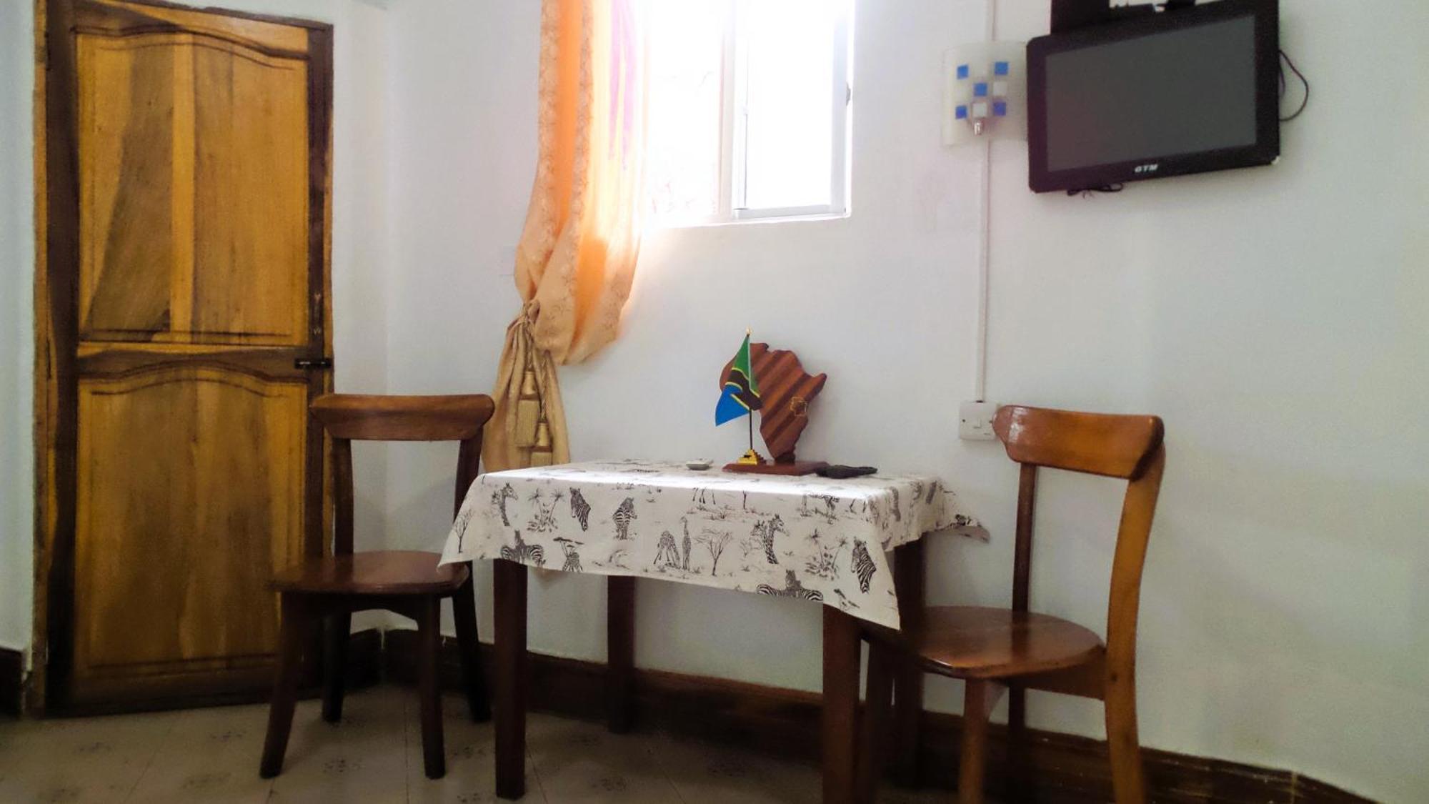 Home Feeling Neneu Lodge Moshi Buitenkant foto